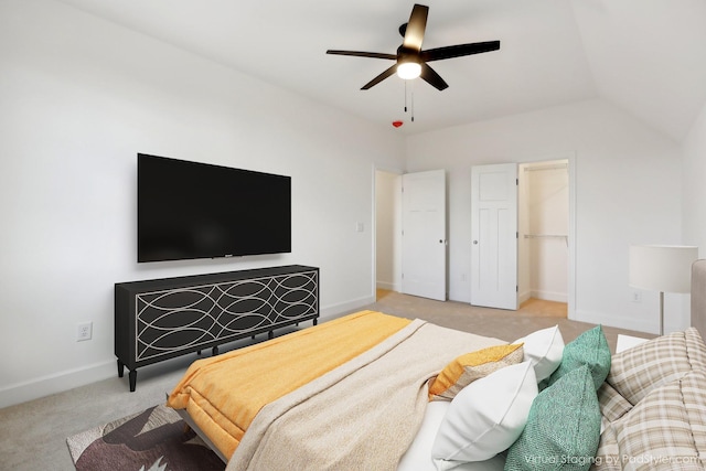 carpeted bedroom featuring lofted ceiling and ceiling fan