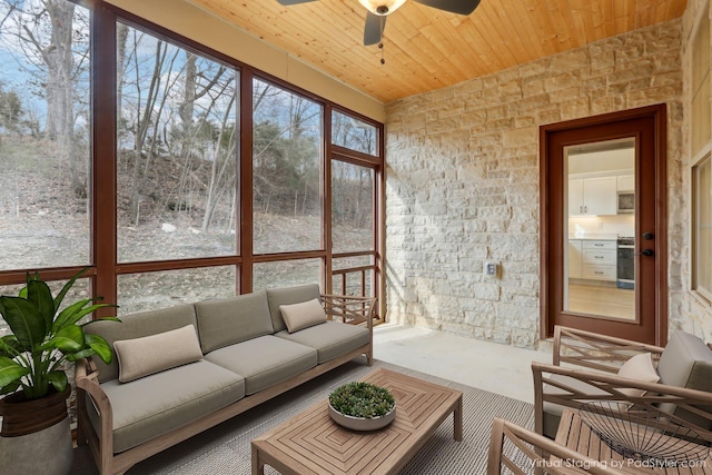 sunroom / solarium with wooden ceiling and ceiling fan