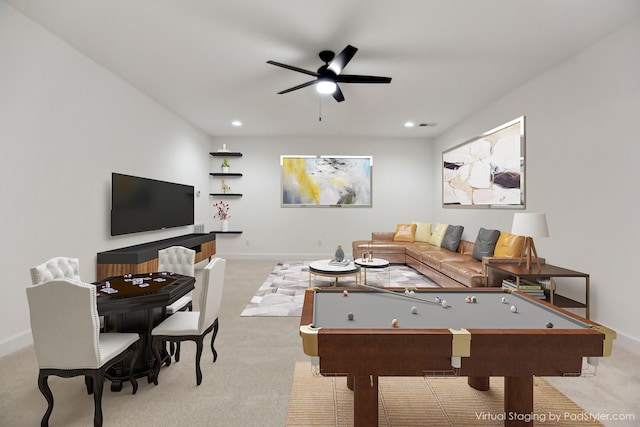 recreation room featuring light carpet and ceiling fan