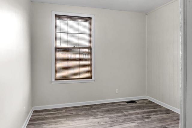 spare room featuring hardwood / wood-style floors