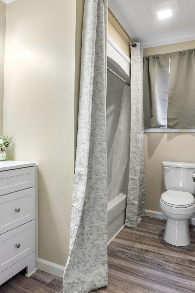 full bathroom featuring shower / bath combination with curtain, wood-type flooring, toilet, and vanity