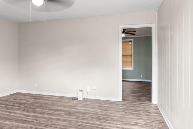 unfurnished room featuring ceiling fan and light wood-type flooring