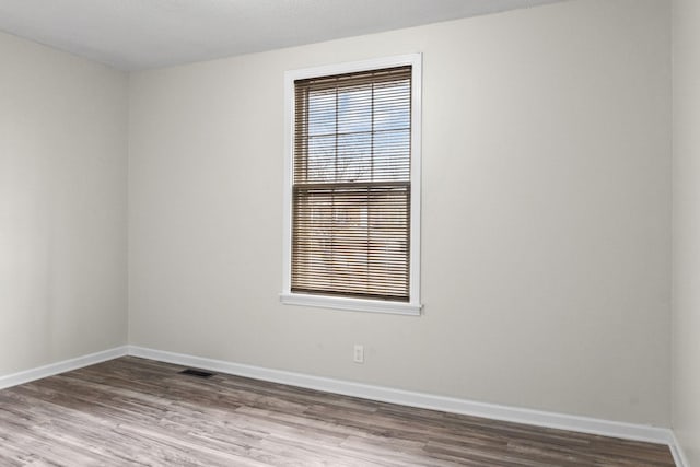 empty room featuring hardwood / wood-style flooring