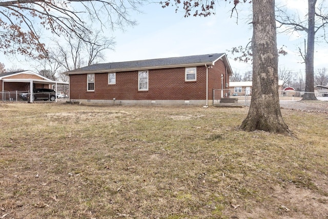 view of property exterior featuring a lawn and a carport