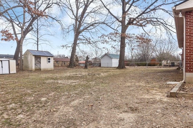 view of yard featuring a storage unit