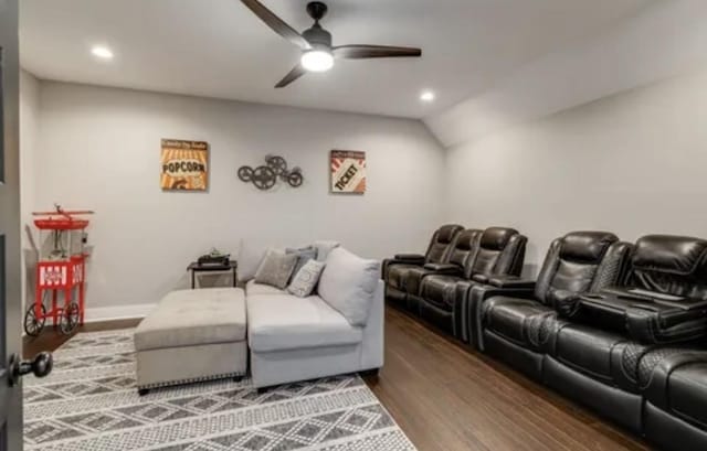 cinema room featuring baseboards, wood finished floors, a ceiling fan, and recessed lighting