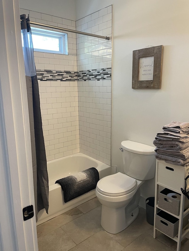 full bath with toilet and shower / bath combo with shower curtain