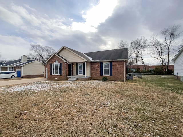 ranch-style home featuring a front lawn