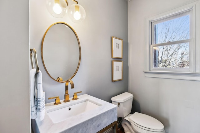 bathroom featuring vanity and toilet