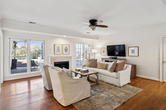 living room with french doors, ceiling fan, and dark hardwood / wood-style floors