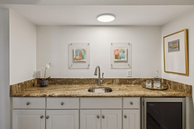 bathroom featuring wine cooler and vanity