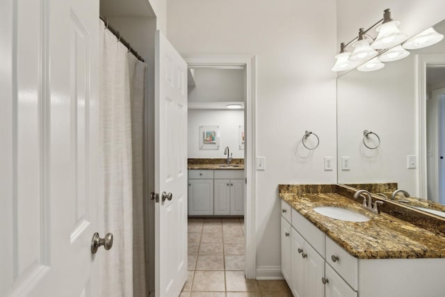 bathroom featuring tile patterned flooring and vanity