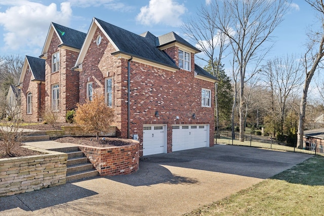 view of side of home featuring a garage