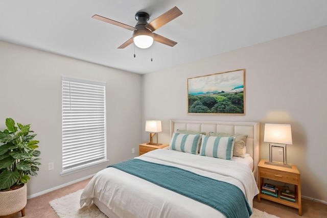 bedroom with light colored carpet and ceiling fan