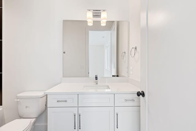 bathroom with vanity and toilet