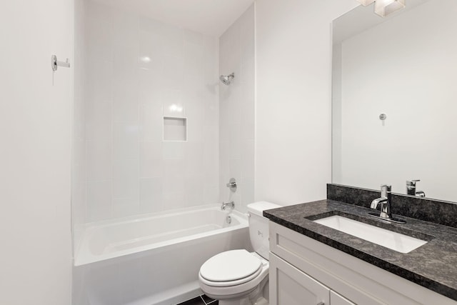 full bathroom featuring tiled shower / bath combo, vanity, and toilet