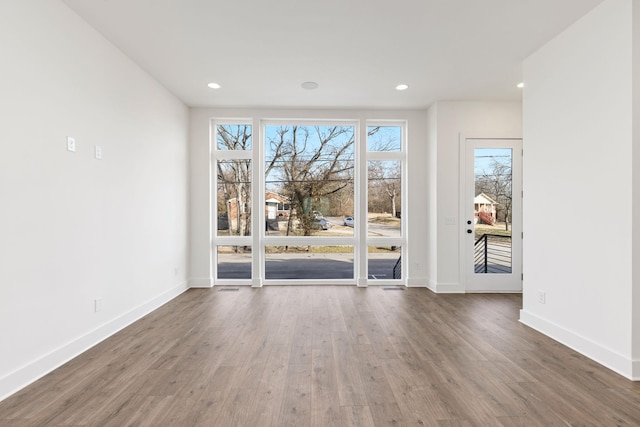 spare room featuring dark hardwood / wood-style flooring