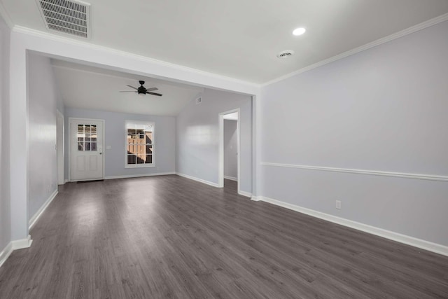 unfurnished living room with visible vents, crown molding, baseboards, lofted ceiling, and dark wood-style floors