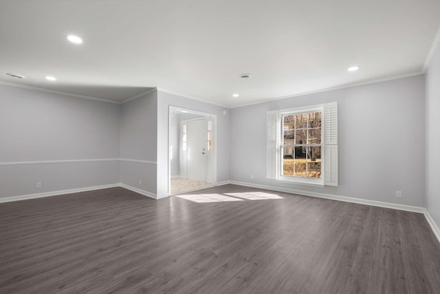 spare room featuring crown molding, recessed lighting, dark wood-style floors, and baseboards