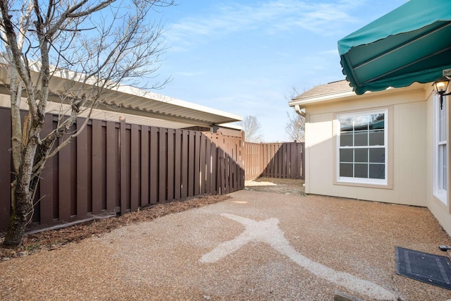 view of yard with a patio area and a fenced backyard