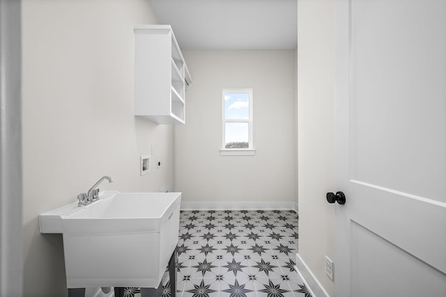 laundry area featuring hookup for an electric dryer, sink, and hookup for a washing machine