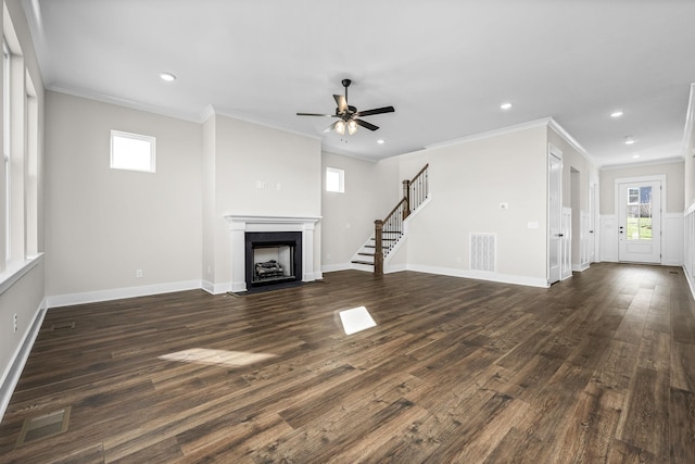 unfurnished living room with crown molding, ceiling fan, and dark hardwood / wood-style flooring