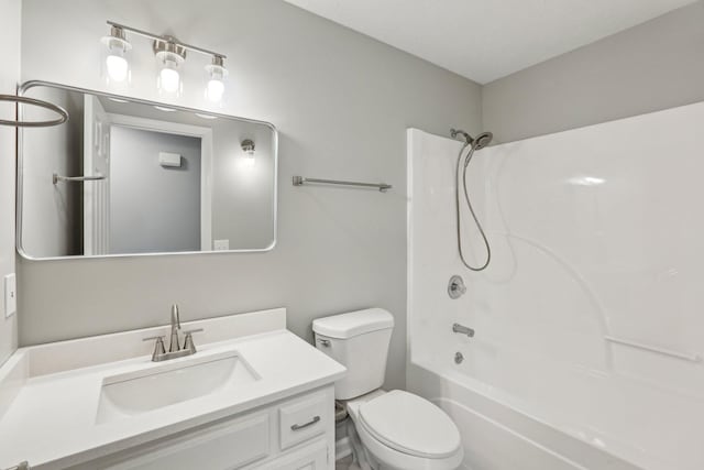 full bathroom featuring vanity, shower / washtub combination, and toilet