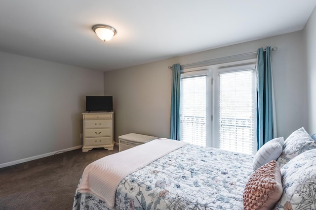 bedroom with dark colored carpet, access to outside, and baseboards