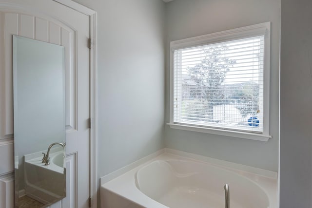 bathroom with a garden tub