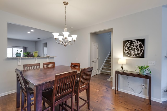 dining area with an inviting chandelier, stairs, baseboards, and dark wood-type flooring