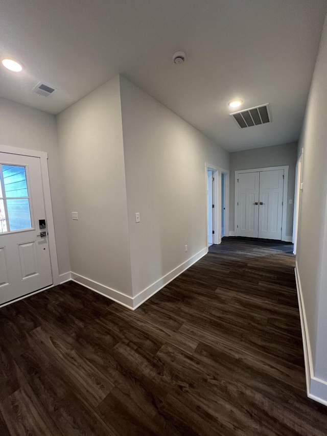 entryway with dark wood-type flooring