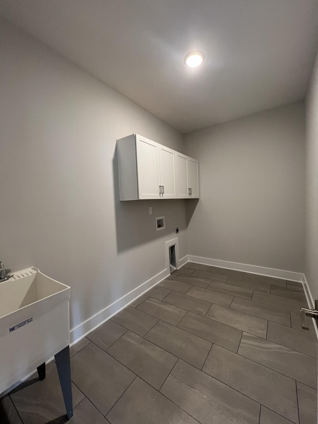 laundry area featuring cabinets, washer hookup, hookup for an electric dryer, and sink