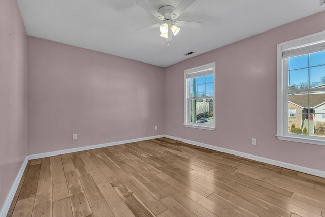 empty room featuring light hardwood / wood-style flooring and ceiling fan