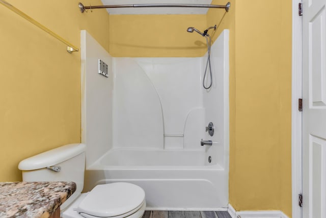 full bathroom with vanity, hardwood / wood-style flooring, tub / shower combination, and toilet