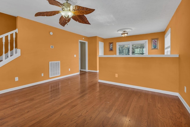 unfurnished living room featuring wood-type flooring and ceiling fan