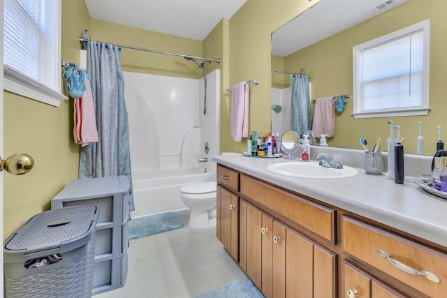 full bathroom featuring vanity, toilet, and shower / tub combo