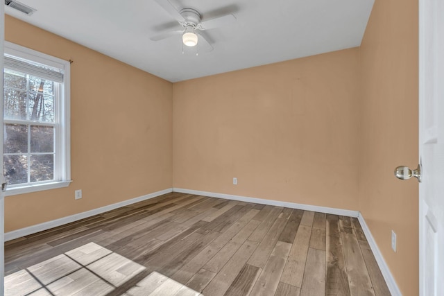 empty room featuring ceiling fan and light hardwood / wood-style flooring