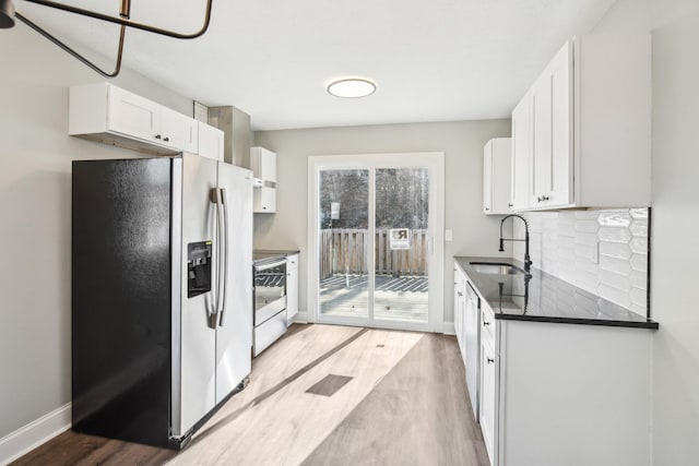 kitchen with white cabinetry, sink, light hardwood / wood-style flooring, and stainless steel appliances