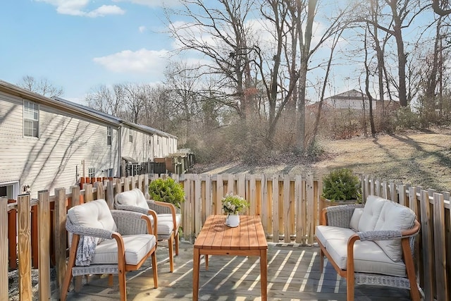 wooden deck featuring outdoor lounge area