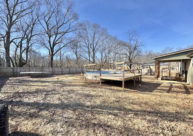 view of yard featuring a wooden deck