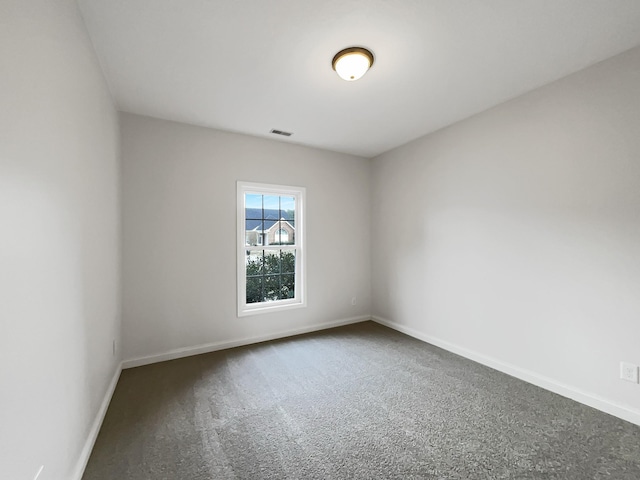 empty room featuring carpet flooring