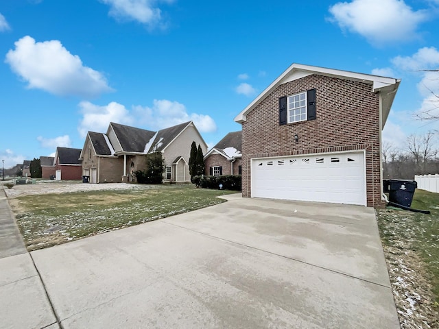 view of front of house with a garage and a front yard