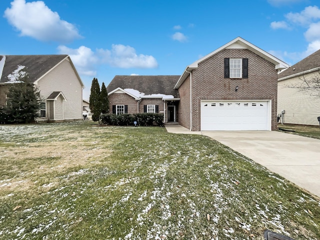 front of property with a garage and a front lawn