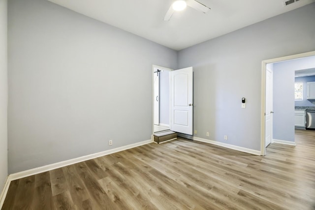 unfurnished bedroom featuring light hardwood / wood-style floors and ceiling fan