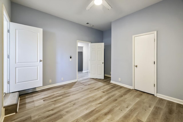 unfurnished bedroom featuring light hardwood / wood-style floors and ceiling fan