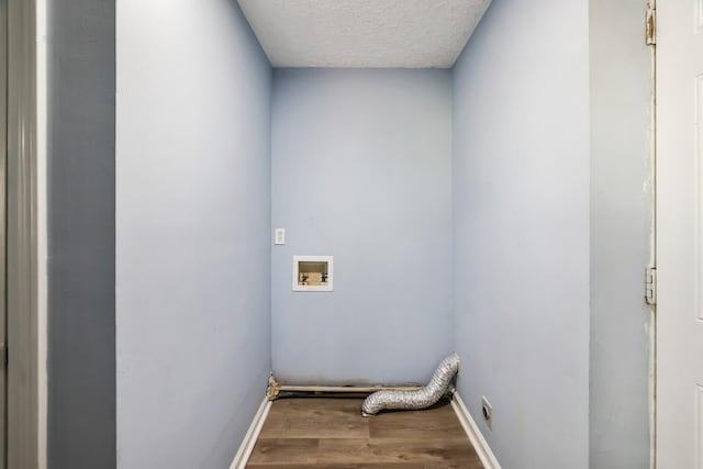 laundry area featuring washer hookup, hardwood / wood-style floors, a textured ceiling, and electric dryer hookup