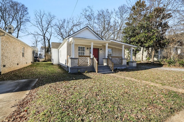 bungalow featuring a front lawn and covered porch