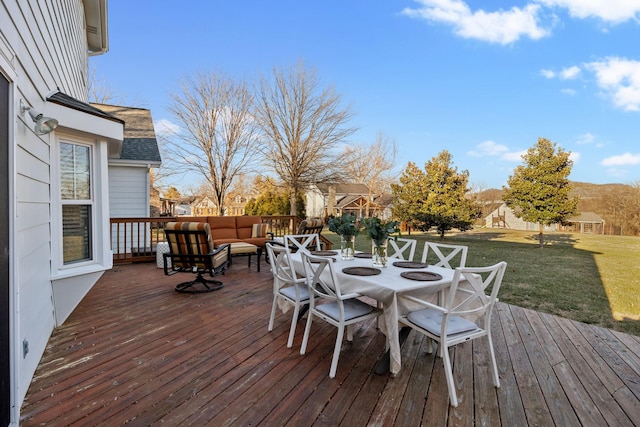 wooden deck featuring a yard and an outdoor hangout area