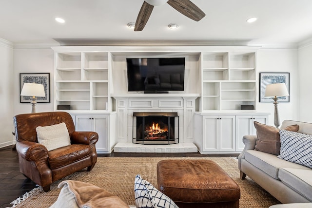 living room with crown molding and ceiling fan