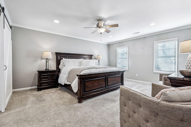 bedroom with crown molding, light colored carpet, a barn door, and ceiling fan